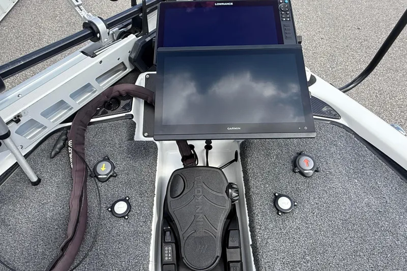 Slide: The Image of 2023 Phoenix 921 Elite II boat dashboard with Garmin and Lowrance displays. - 33
