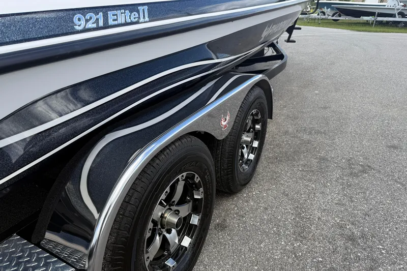 Slide: The Image of 2023 Phoenix 921 Elite II boat trailer with dual wheels on pavement. - 4
