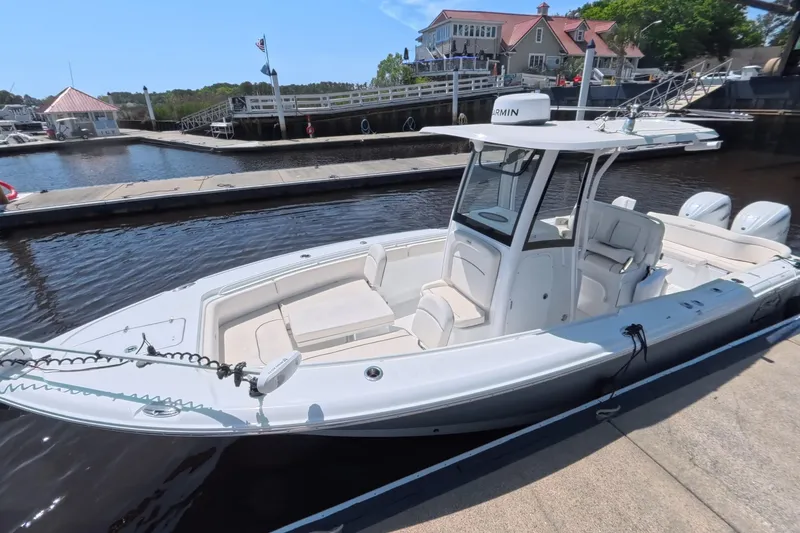The Image of 2025 Sea Hunt Ultra 275 SE boat on calm water, featuring dual Yamaha engines. - 0