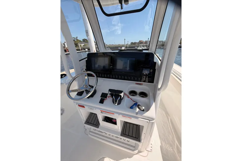 Slide: The Image of 2025 Sea Hunt Ultra 275 SE boat with seating area. - 11