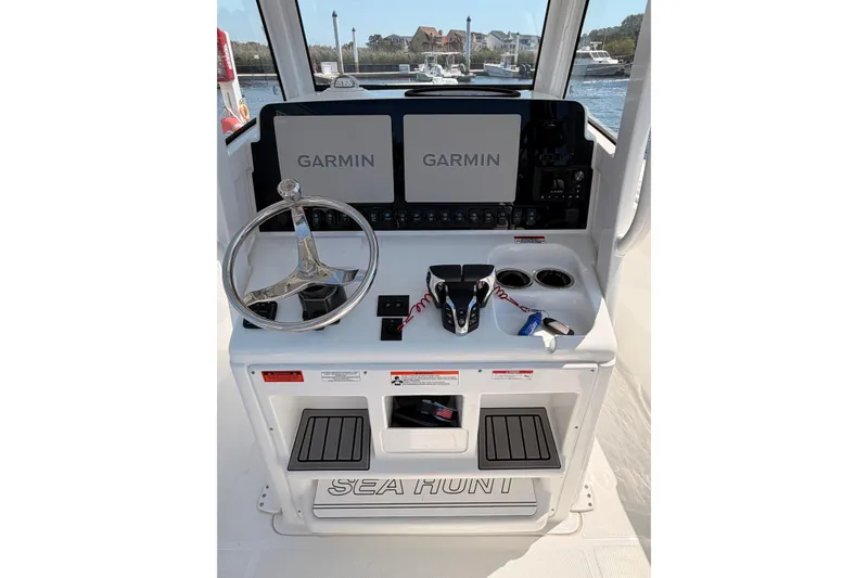 Slide: The Image of Sea Hunt Ultra 275 SE 2025 at dock, front view. - 12