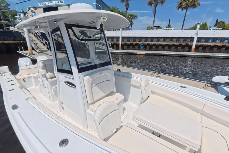 Slide: The Image of Sea Hunt Ultra 275 SE 2025 docked with Yamaha engines. - 5