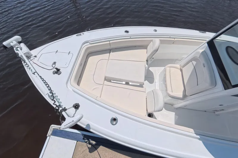 Slide: The Image of Sea Hunt Ultra 275 SE 2025 with twin outboard engines at dock. - 6