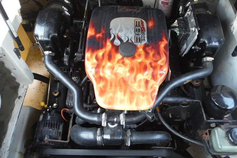 Slide: The Image of Engine of 2005 Sea Ray 220 Sundeck with flame design cover. - 19