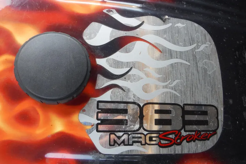 Slide: The Image of Close-up of a 383 Mag Stroker engine cover with flame design on a 2005 Sea Ray 220 Sundeck. - 20