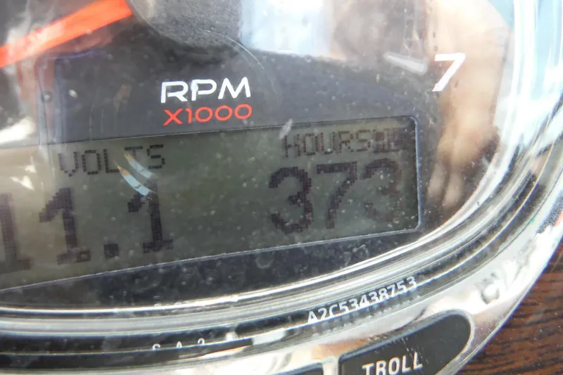 Slide: The Image of Close-up of a 2005 Sea Ray 220 Sundeck gauge showing 373 hours and 11.1 volts. - 23