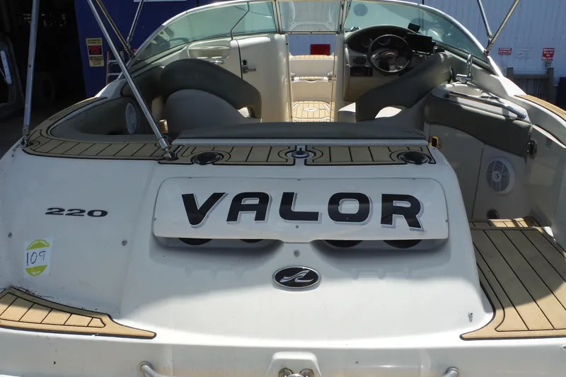 Slide: The Image of 2005 Sea Ray 220 Sundeck boat interior with "Valor" nameplate. - 6