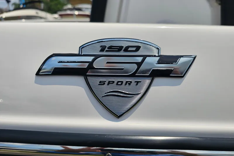 Slide: The Image of 2022 Yamaha Boats 190 FSH Sport emblem on white surface. - 15