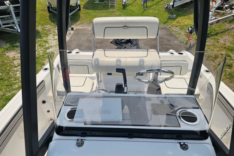 Slide: The Image of 2022 Yamaha Boats 190 FSH Sport interior with steering wheel and seating area. - 29