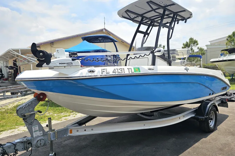 Slide: The Image of 2022 Yamaha Boats 190 FSH Sport in blue on trailer, featuring Minn Kota trolling motor. - 3