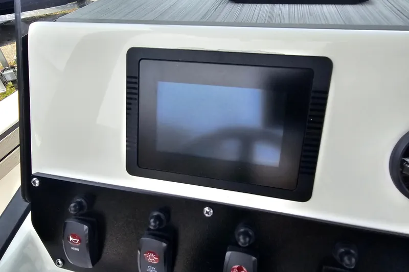 Slide: The Image of Dashboard of 2022 Yamaha Boats 190 FSH Sport with touchscreen and control switches. - 33