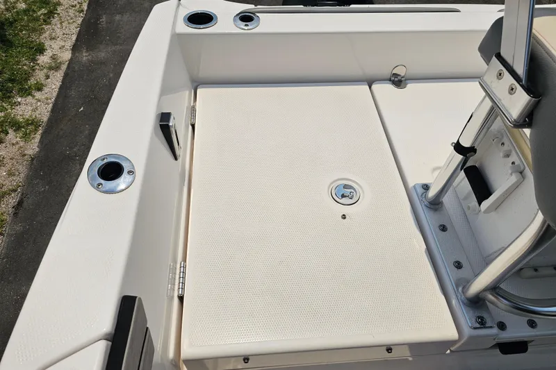 Slide: The Image of 2022 Yamaha Boats 190 FSH Sport deck with seating and storage features. - 36