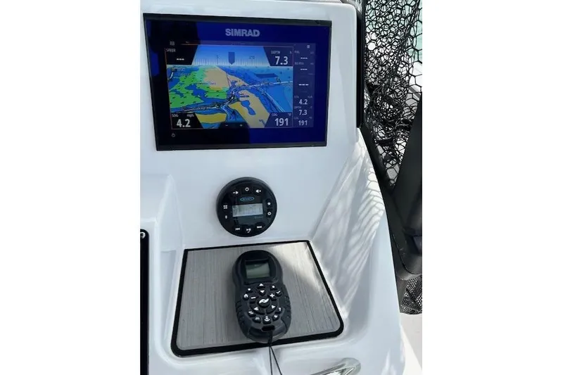 Slide: The Image of Yamaha Boats 2022 190 FSH Sport dashboard with Simrad navigation display and controls. - 39