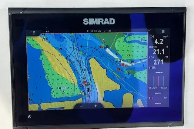 Slide: The Image of Simrad navigation display on 2022 Yamaha Boats 190 FSH Sport, showing nautical chart and data. - 40