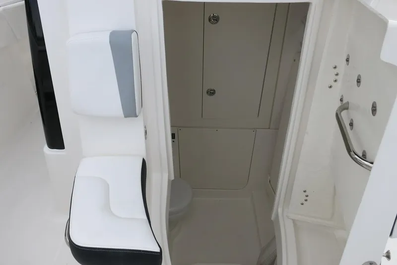 Slide: The Image of Interior view of 2026 Robalo R300 Center Console boat cabin. - 15
