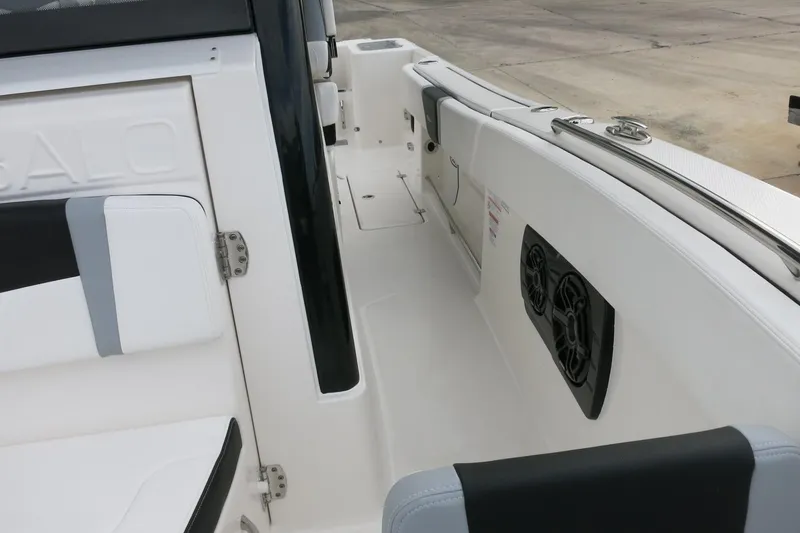 Slide: The Image of 2026 Robalo R300 Center Console boat interior with seating and speakers. - 17