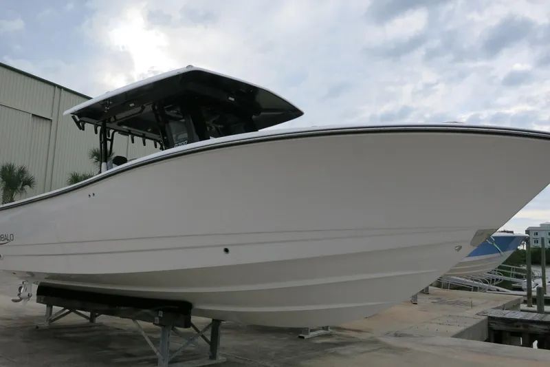 Slide: The Image of 2026 Robalo R300 Center Console boat on display, showcasing sleek design and modern features. - 2