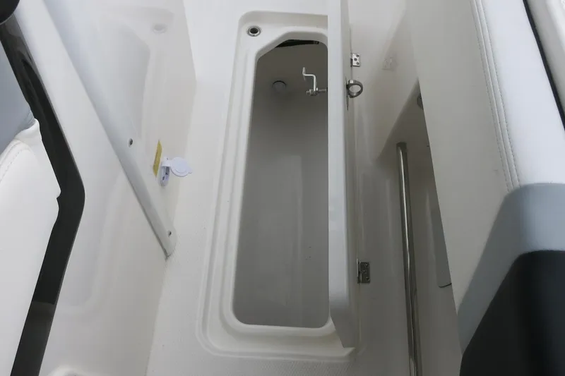 Slide: The Image of 2026 Robalo R300 Center Console storage compartment interior view. - 20