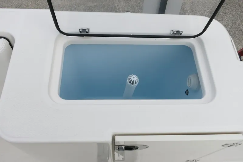 Slide: The Image of Livewell compartment on 2026 Robalo R300 Center Console boat. - 27