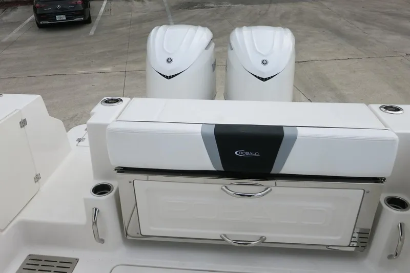 Slide: The Image of 2026 Robalo R300 Center Console boat with dual engines and seating area. - 29