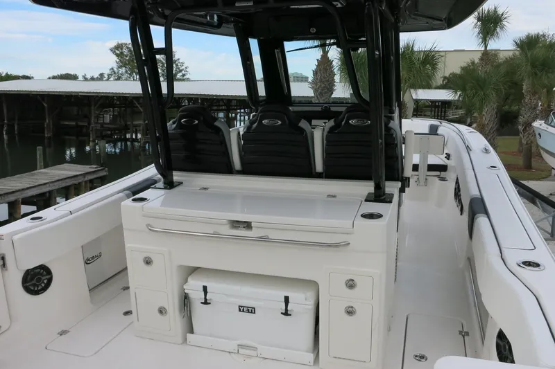 Slide: The Image of 2026 Robalo R300 Center Console boat interior with seating and storage. - 6