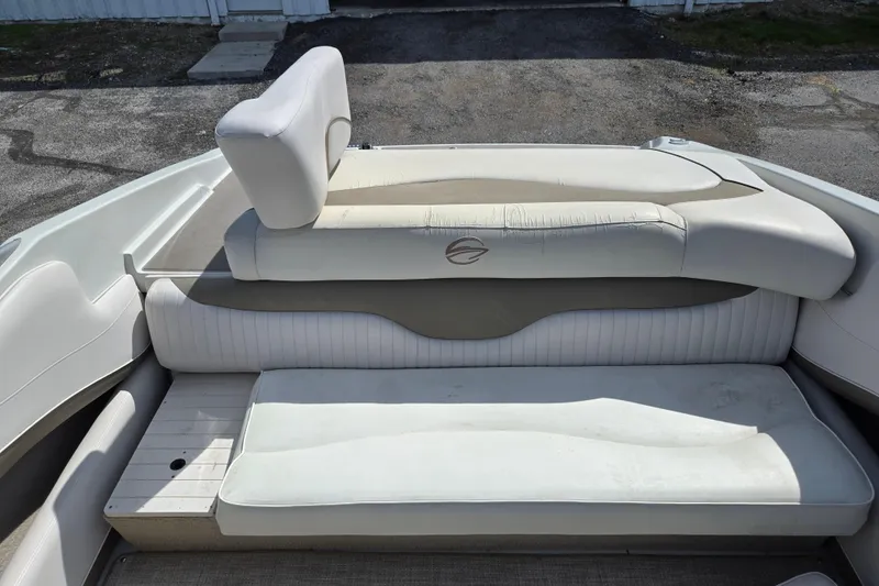 Slide: The Image of 2014 Crownline 21 SS boat interior with white cushioned seating. - 10