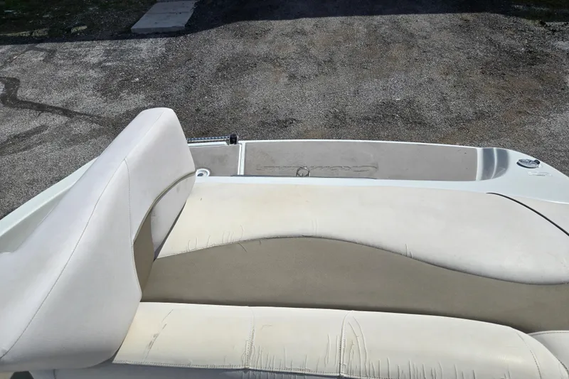 Slide: The Image of 2014 Crownline 21 SS boat interior with beige and white seating. - 11