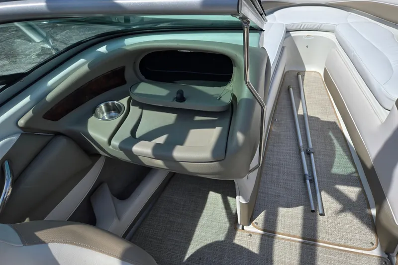 Slide: The Image of Interior of a 2014 Crownline 21 SS boat, featuring seating and storage areas. - 16