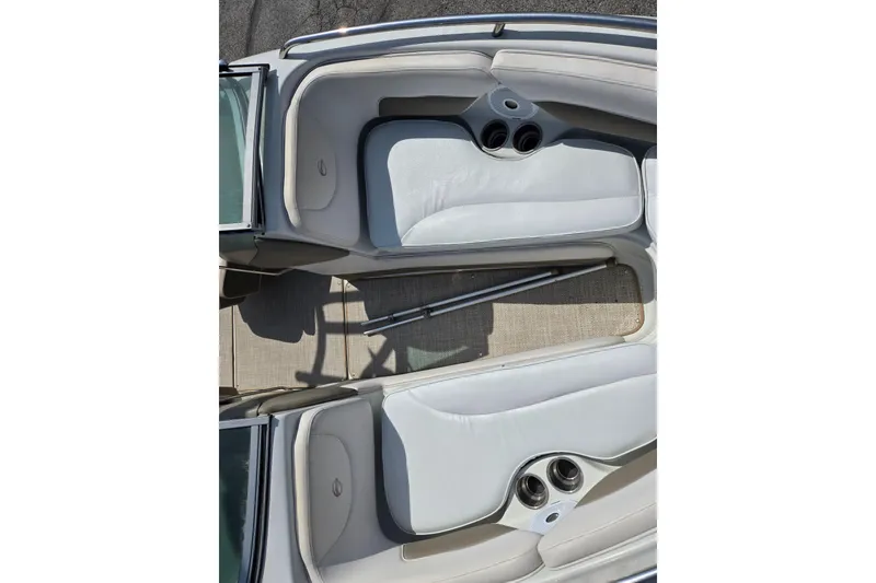 Slide: The Image of 2014 Crownline 21 SS boat interior with white seating and cup holders. - 20