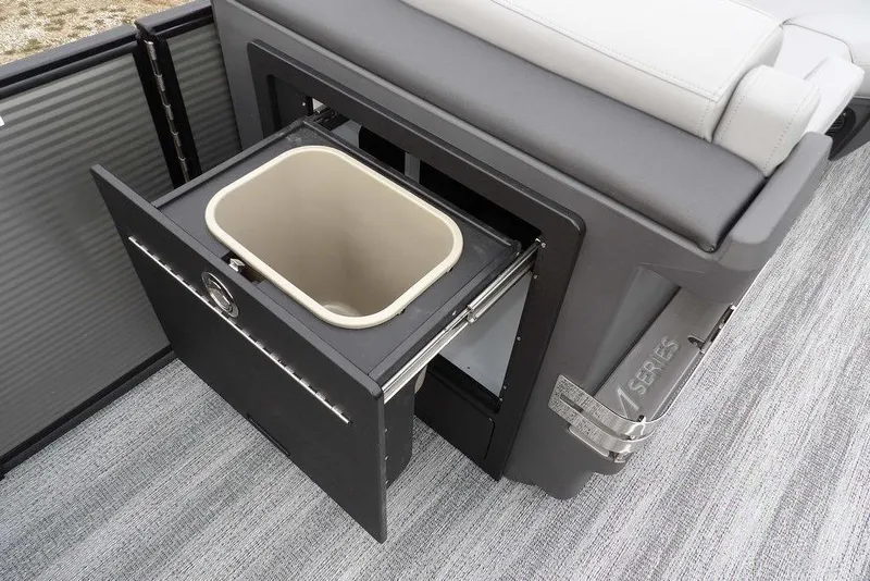 Slide: The Image of 2026 Bennington M L-Bench 22 ML with integrated storage compartment and pull-out bin. - 16