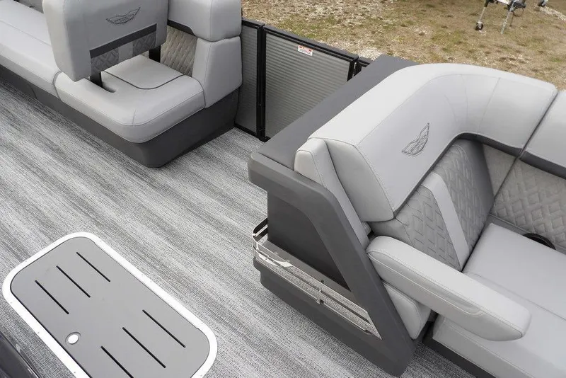 Slide: The Image of 2026 Bennington M L-Bench 22 ML boat interior with gray seating and flooring. - 17