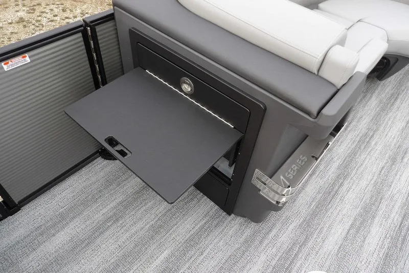 Slide: The Image of Bennington M L-Bench 22 ML 2026 boat interior with fold-out storage compartment. - 18