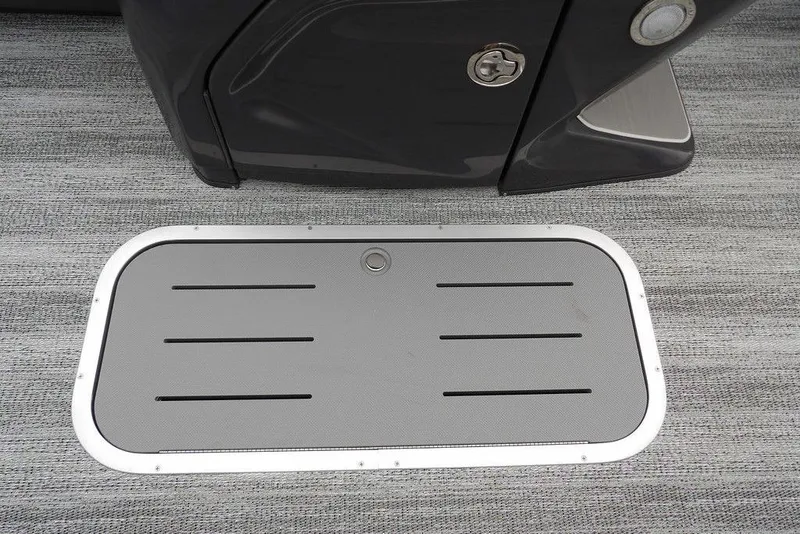 Slide: The Image of 2026 Bennington M L-Bench 22 ML boat floor hatch on textured surface. - 19