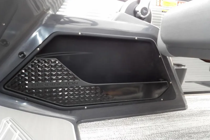 Slide: The Image of 2026 Bennington M L-Bench 22 ML interior detail with storage compartment. - 25