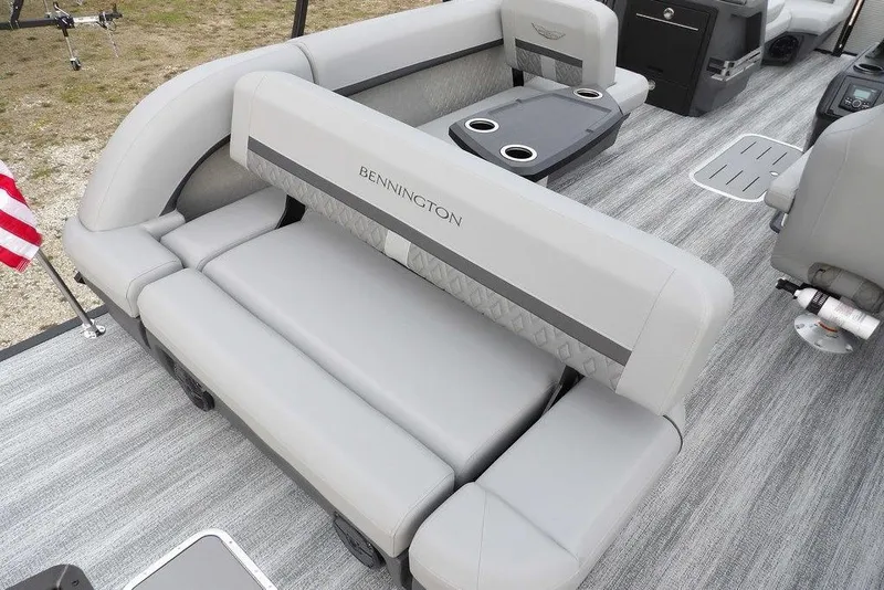 Slide: The Image of 2026 Bennington M L-Bench 22 ML pontoon boat interior with gray seating and cup holders. - 28