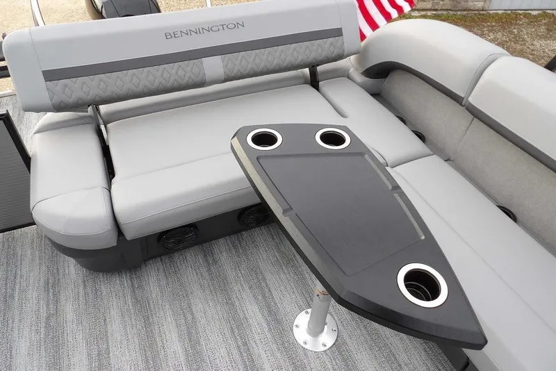 Slide: The Image of 2026 Bennington M L-Bench 22 ML boat interior with gray seating and table. - 29