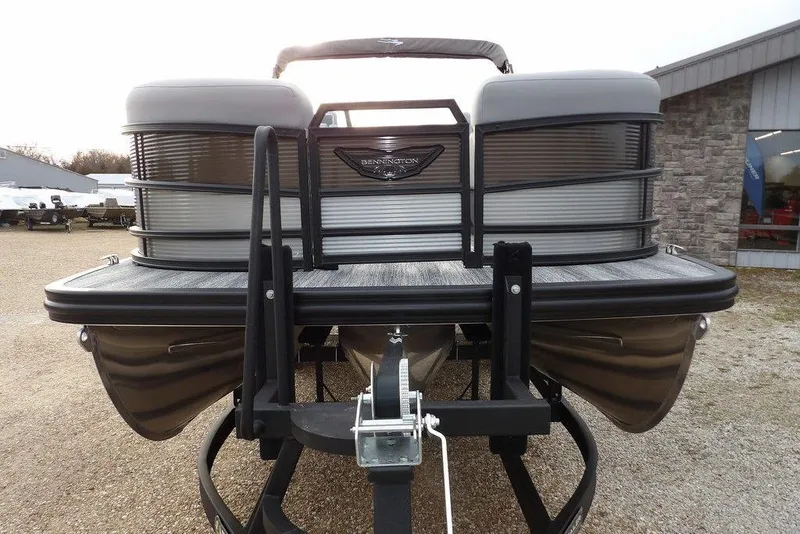 Slide: The Image of 2026 Bennington M L-Bench 22 ML pontoon boat front view on trailer. - 3