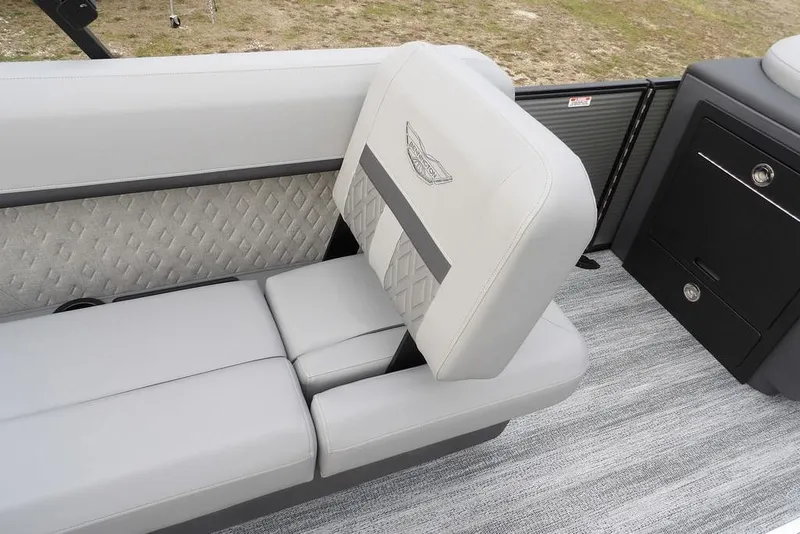 Slide: The Image of 2026 Bennington M L-Bench 22 ML boat interior with luxurious gray seating and diamond pattern accents. - 34
