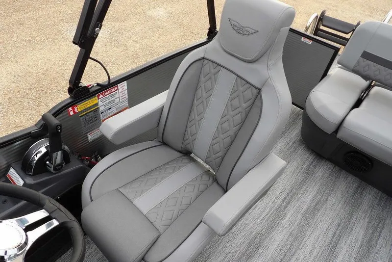 Slide: The Image of 2026 Bennington M L-Bench 22 ML boat interior with luxurious gray seating and controls. - 38