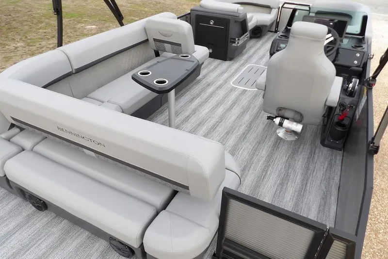 Slide: The Image of 2026 Bennington M L-Bench 22 ML pontoon boat interior with gray seating and modern helm. - 41