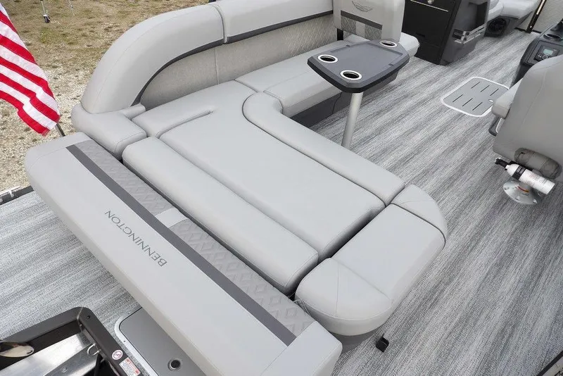 Slide: The Image of 2026 Bennington M L-Bench 22 ML pontoon boat interior with gray seating and cup holders. - 47