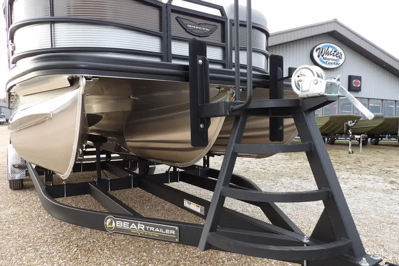 Slide: The Image of 2026 Bennington M L-Bench 22 ML pontoon boat on Bear trailer at marine center. - 50