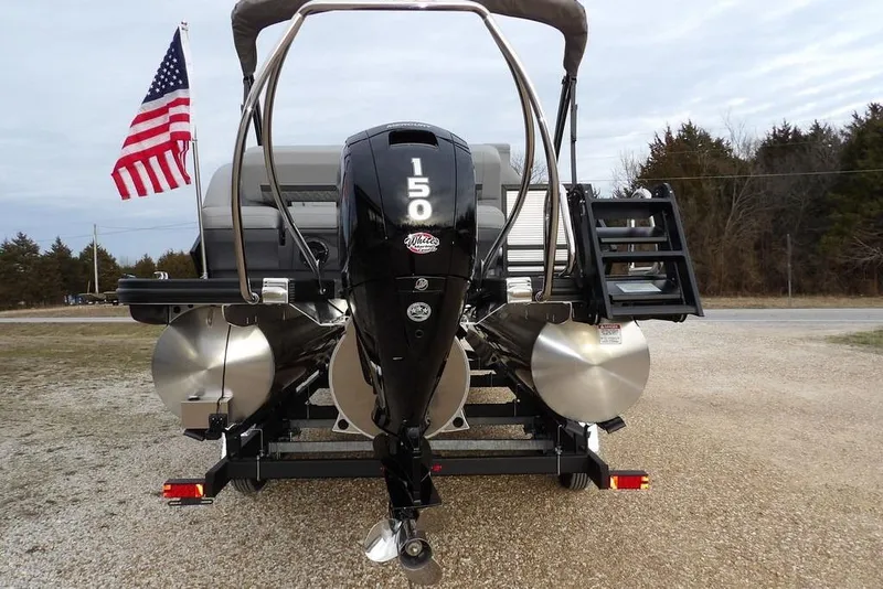 Slide: The Image of 2026 Bennington M L-Bench 22 ML pontoon boat with 150 HP motor and American flag. - 53