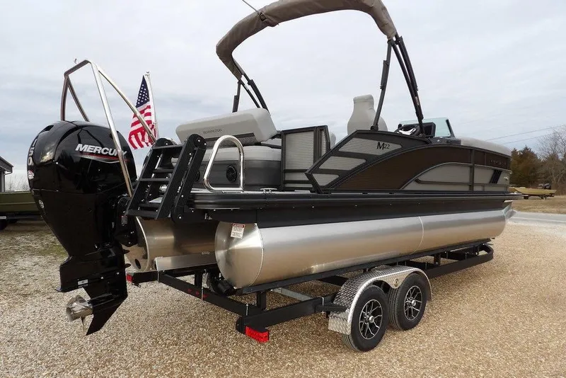 Slide: The Image of 2026 Bennington M L-Bench 22 ML pontoon boat with Mercury engine on trailer. - 6