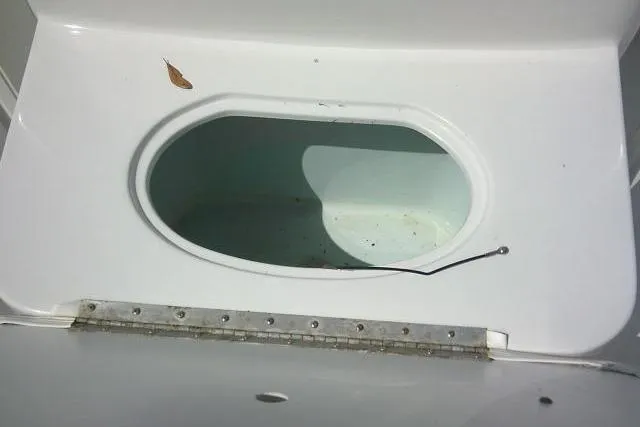 Slide: The Image of Open storage compartment on a 2010 Sea Hunt Triton 202 boat. - 18