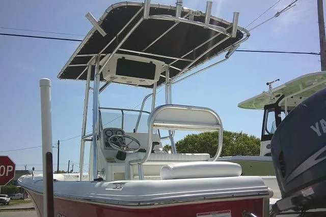 Slide: The Image of 2010 Sea Hunt Triton 202 boat with T-top and Yamaha outboard motor. - 2