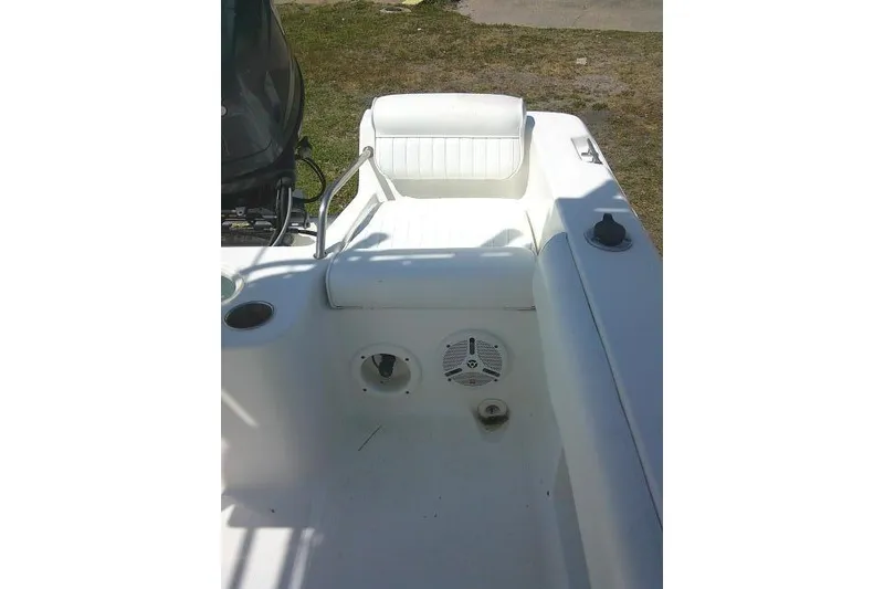 Slide: The Image of 2010 Sea Hunt Triton 202 boat interior with seating and storage compartments. - 22