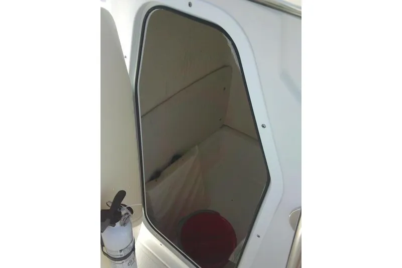 Slide: The Image of Interior cabin view of a 2010 Sea Hunt Triton 202 boat. - 28