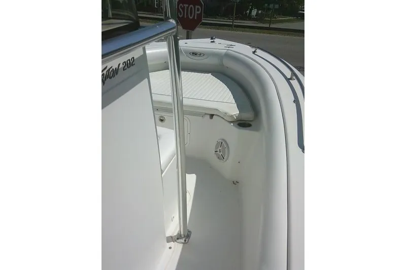 Slide: The Image of 2010 Sea Hunt Triton 202 boat interior with seating and railing. - 30