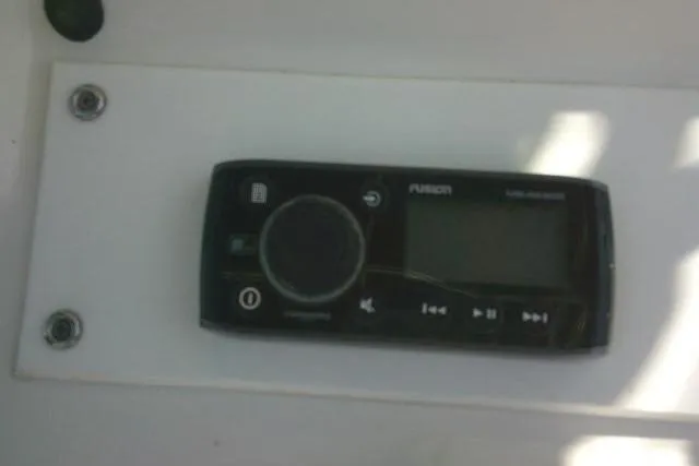 Slide: The Image of Fusion marine stereo system on a 2010 Sea Hunt Triton 202 boat. - 32